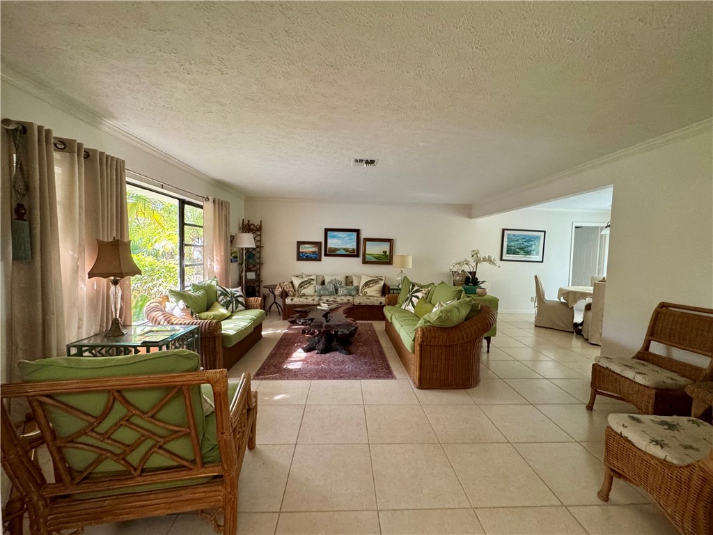 1946 Surfside Terrace Vero Beach, FL 32963 - Photo 6 of 36 a living room with furniture and a flat screen tv