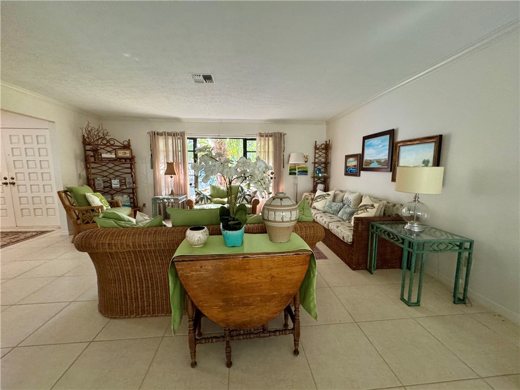 1946 Surfside Terrace Vero Beach, FL 32963 - Photo 7 of 36 a living room with fireplace furniture and a potted plant