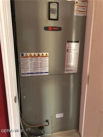 a living room with furniture and a floor to to ceiling window