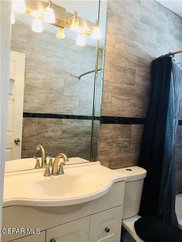 a kitchen with a stove microwave and sink