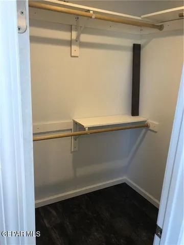 a bedroom with a bed couch and window