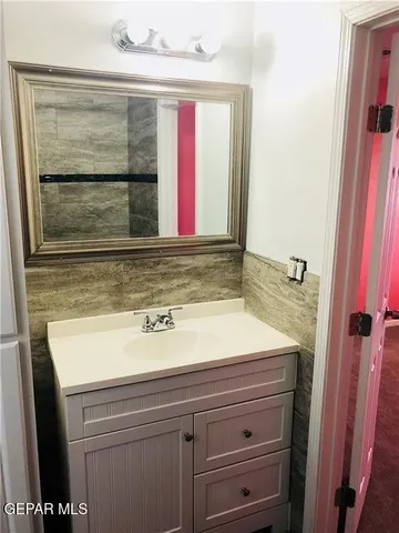 a bathroom with a glass door shower