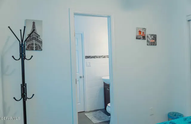 a living room with furniture a rug and a large window