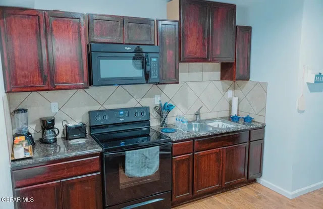 a bathroom with a toilet a sink and a mirror