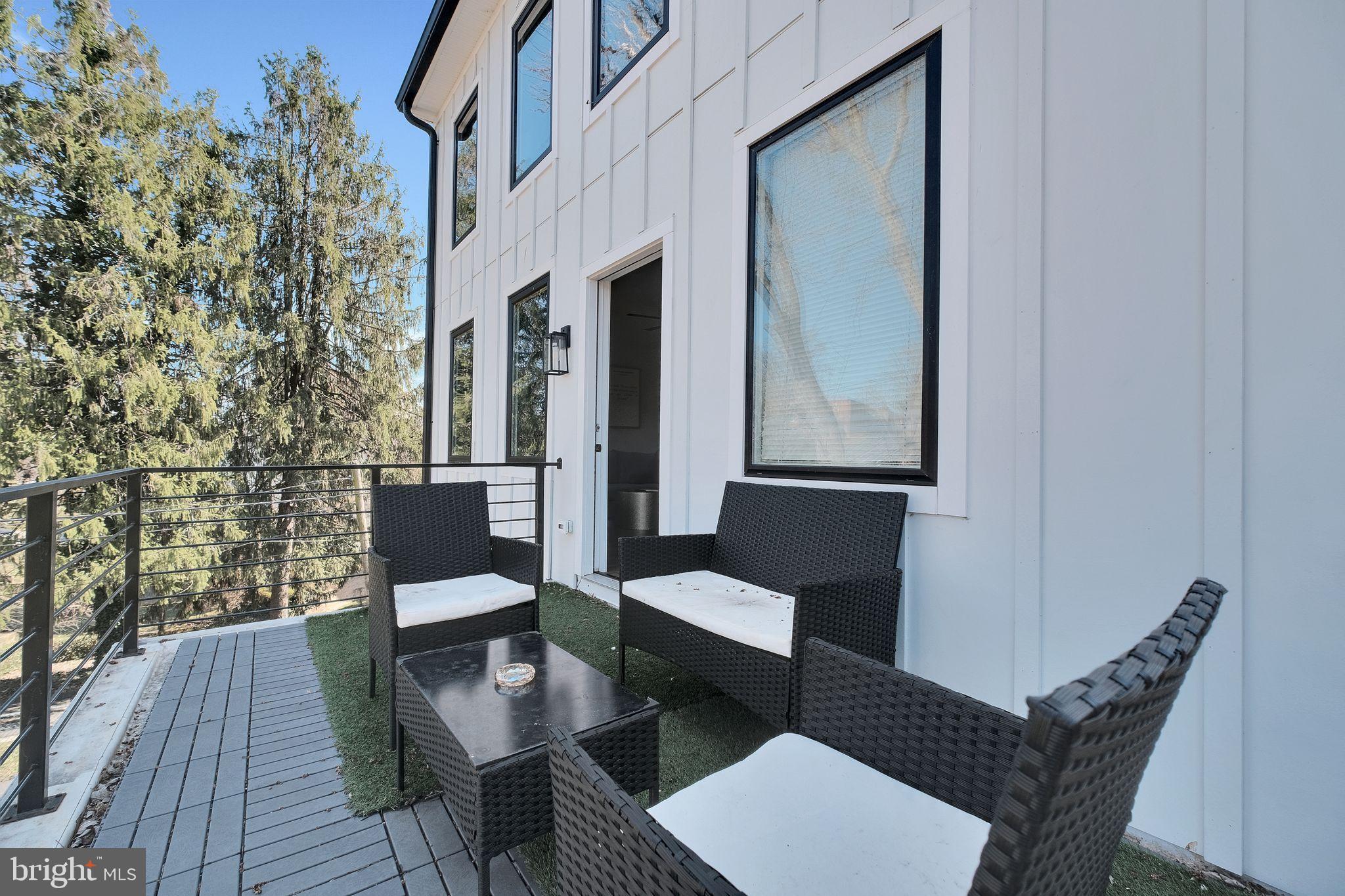 3811 Suitland Road Southeast Washington, DC 20020 - Photo 26 of 47 3rd level fam room/balcony.