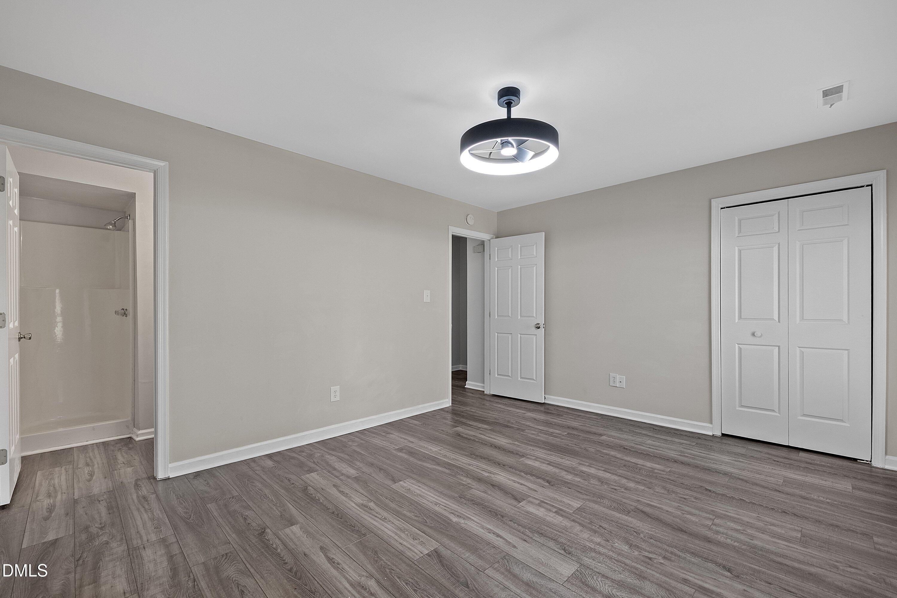 1900 Township Circle Raleigh, NC 27609 - Photo 13 of 19 a view of an empty room with wooden floor
