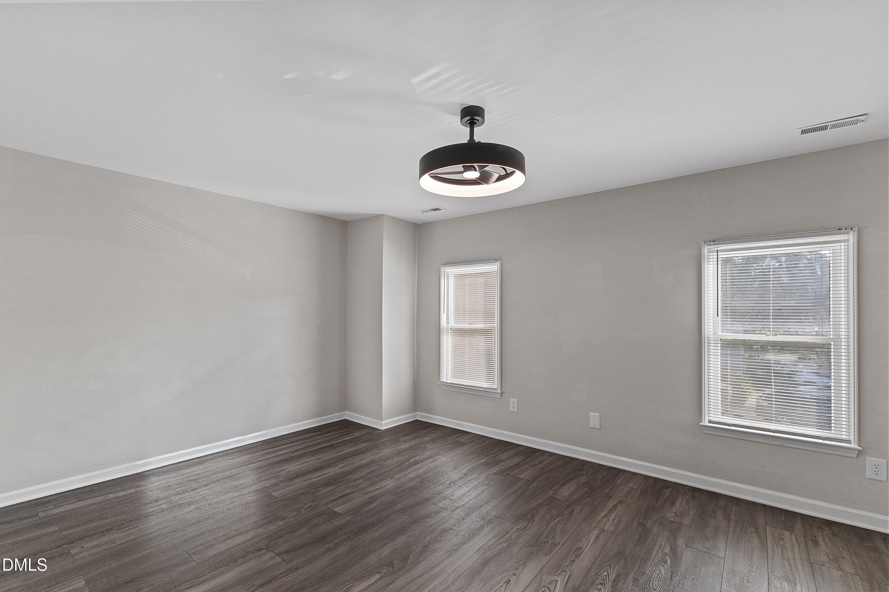 1900 Township Circle Raleigh, NC 27609 - Photo 16 of 19 a view of an empty room with wooden floor and a window