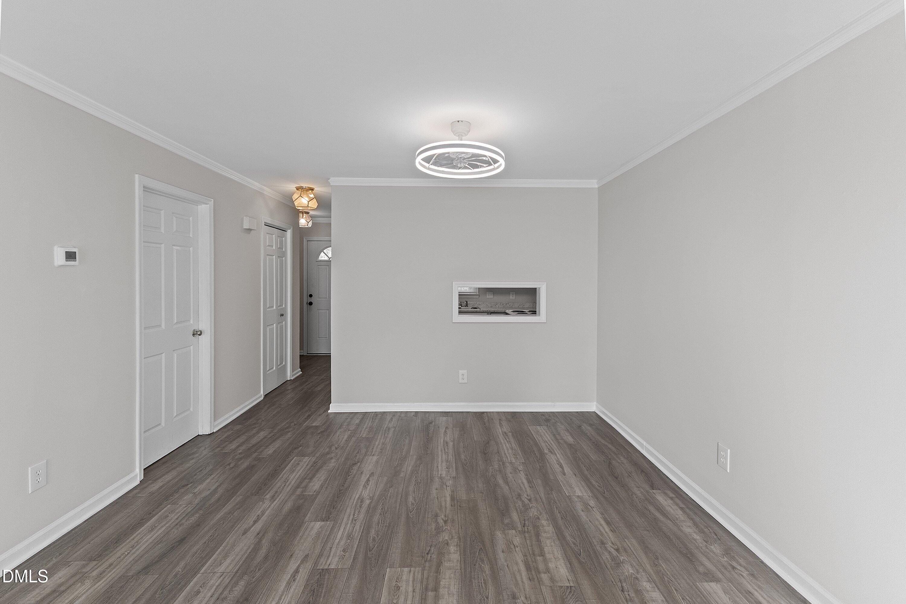 1900 Township Circle Raleigh, NC 27609 - Photo 9 of 19 a view of a room with wooden floor and white walls