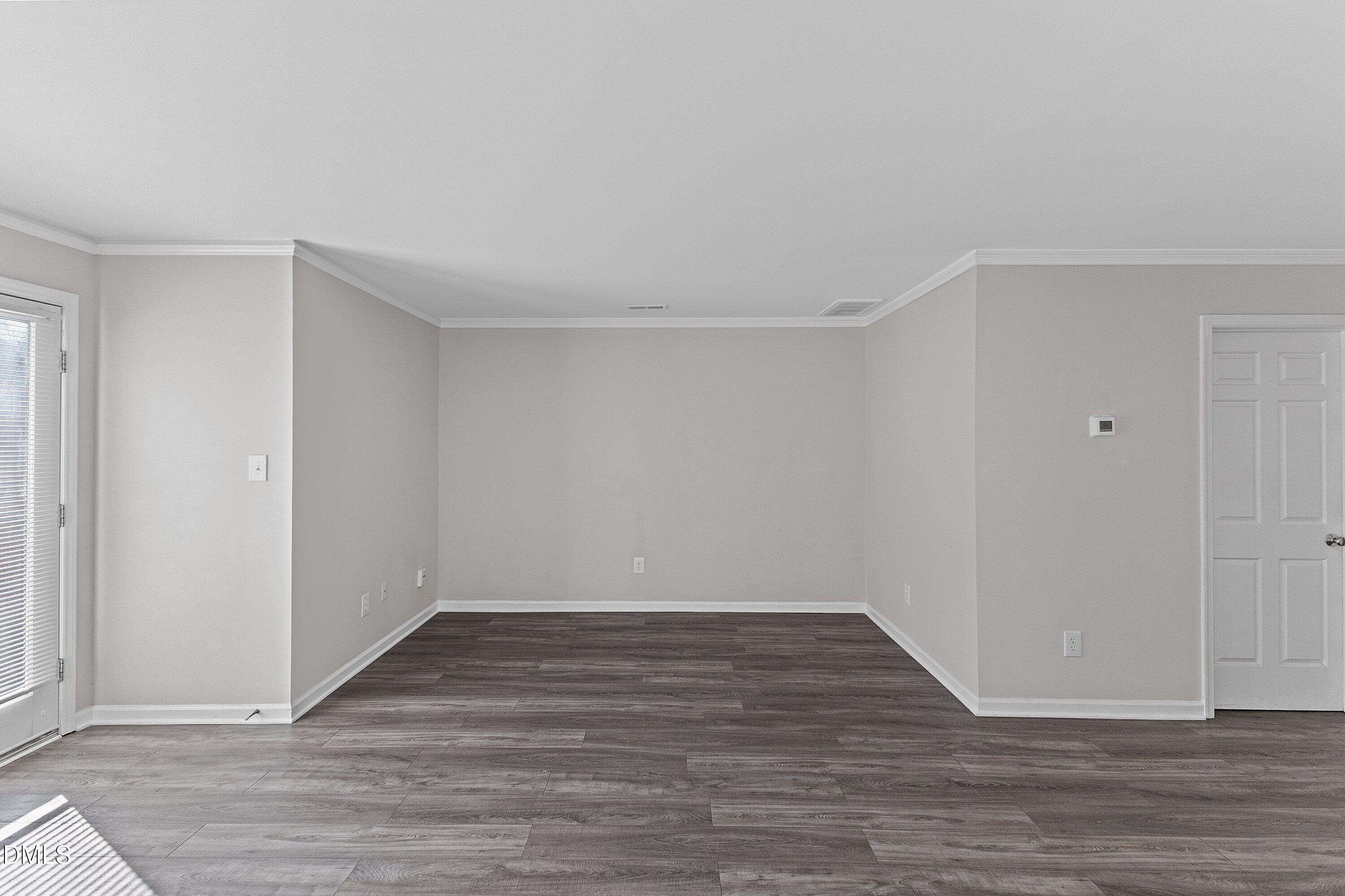 1900 Township Circle Raleigh, NC 27609 - Photo 10 of 19 a view of an empty room with wooden floor