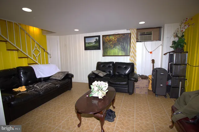 a living room with furniture fireplace and a flat screen tv