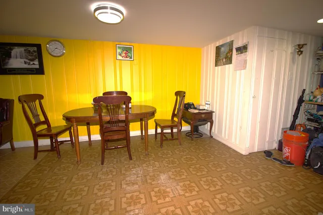 a view of a livingroom with furniture and a window