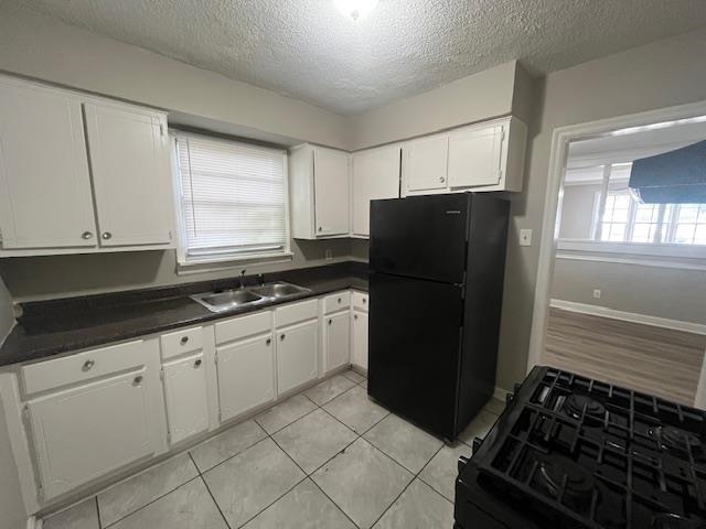 1021 Getwell Road Memphis, TN 38111 - Photo 8 of 25 a kitchen with granite countertop a refrigerator and a sink