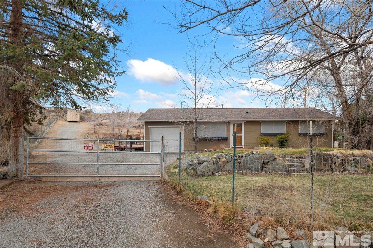 8925 Limnol Street Reno, NV 89506 - Photo 1 of 32 a view of a house with a yard