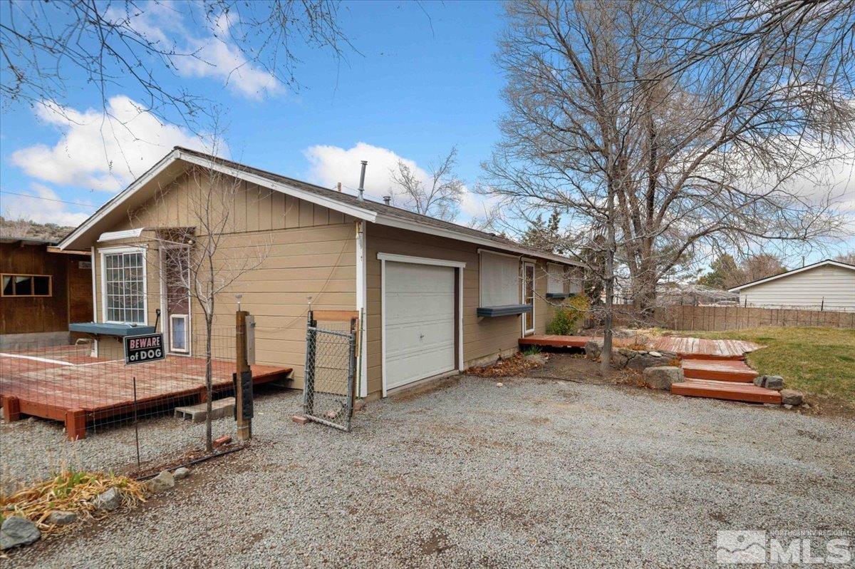 8925 Limnol Street Reno, NV 89506 - Photo 17 of 32 a view of a house with a yard and sitting area