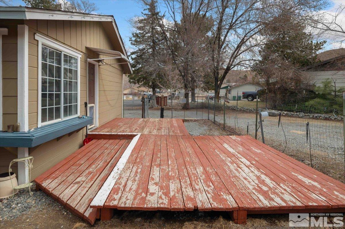 8925 Limnol Street Reno, NV 89506 - Photo 18 of 32 a view of backyard with wooden floor and fence
