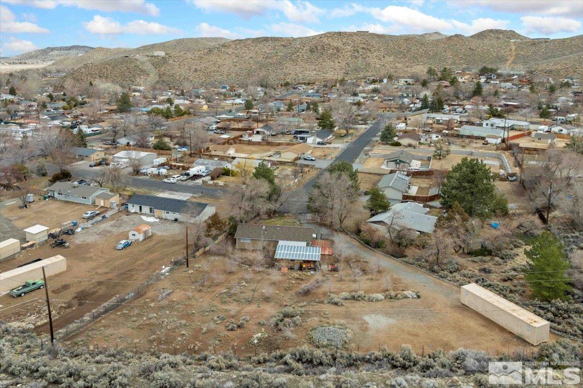8925 Limnol Street Reno, NV 89506 - Photo 27 of 32 an aerial view of residential house with parking space