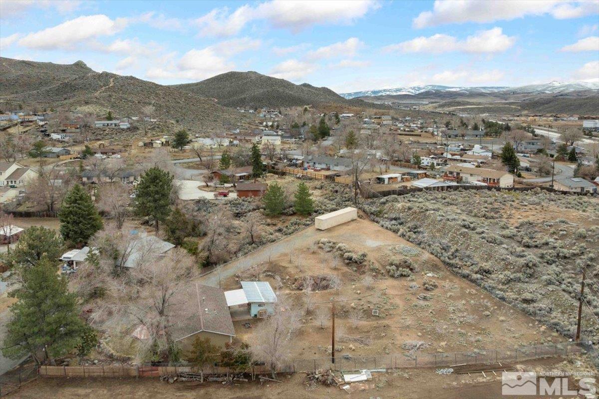 8925 Limnol Street Reno, NV 89506 - Photo 28 of 32 a view of a dry yard with mountains in the background