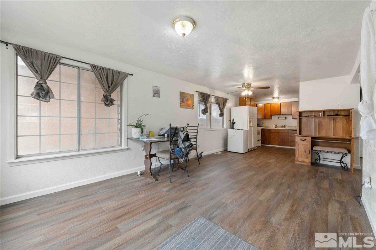 8925 Limnol Street Reno, NV 89506 - Photo 7 of 32 a living room with furniture and a wooden floor