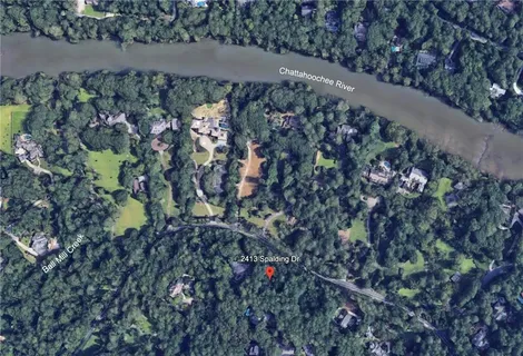 an aerial view of a house with lots of trees