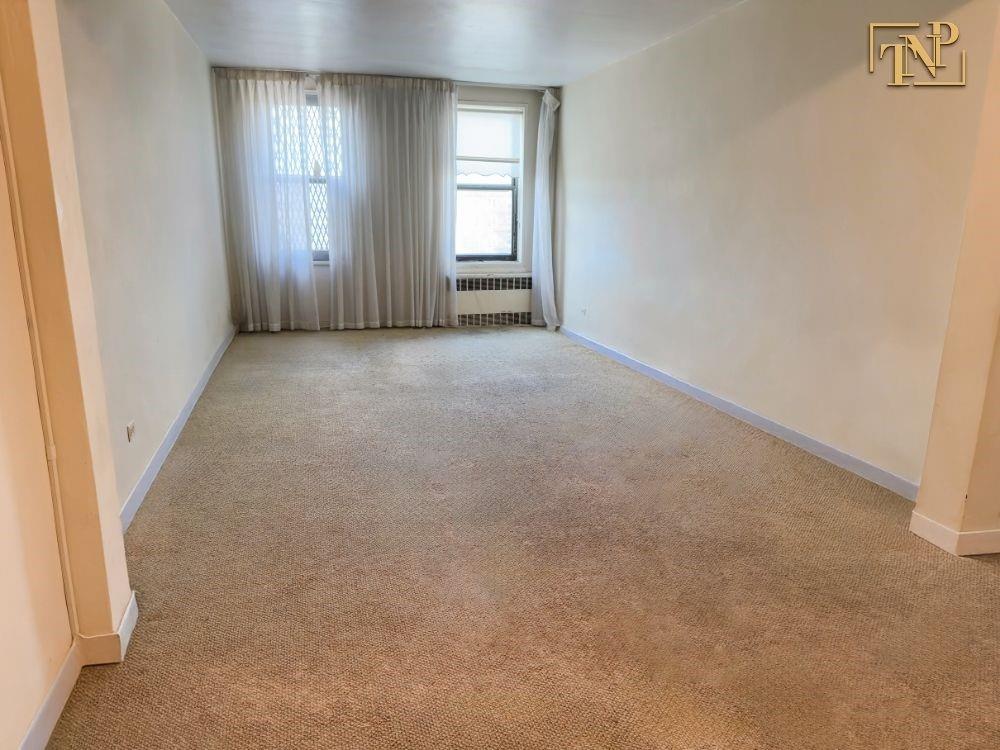 2450 Haring Street, Unit 6D Brooklyn, NY 11235 - Photo 3 of 6 an empty room with windows
