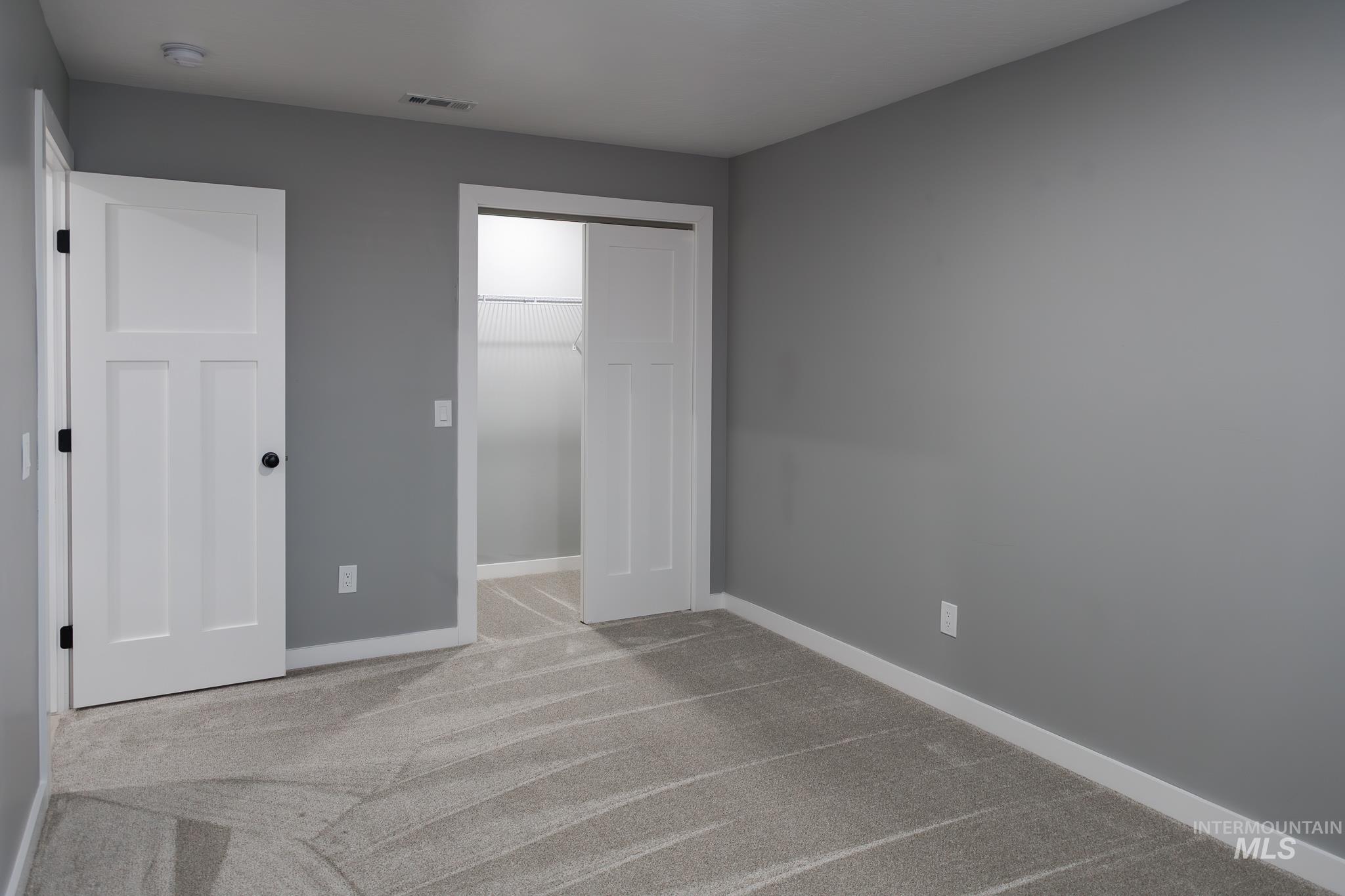 297 Southwest 6th Street, Unit 1 Ontario, OR 97914 - Photo 39 of 50 Unfurnished bedroom with carpet and baseboards