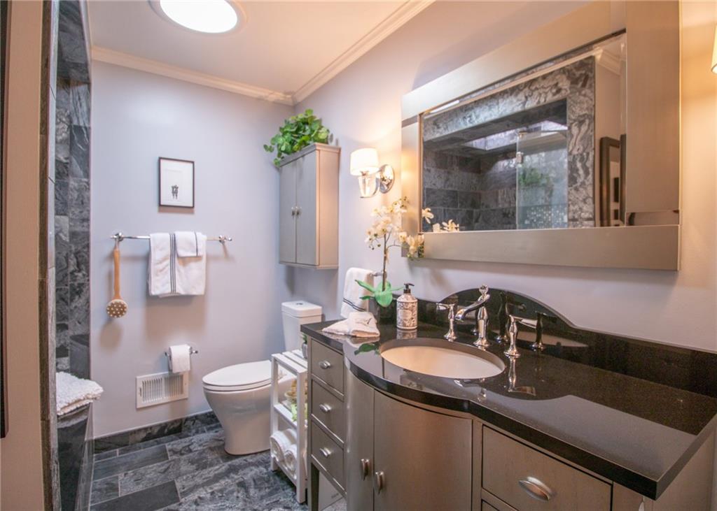 620 Timberline Lane New Stanton, PA 15672 - Photo 19 of 37 a bathroom with a sink and a mirror