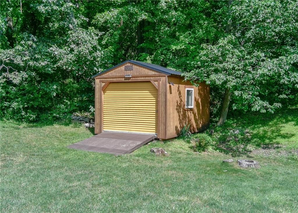 620 Timberline Lane New Stanton, PA 15672 - Photo 29 of 37 a front view of a house with a yard