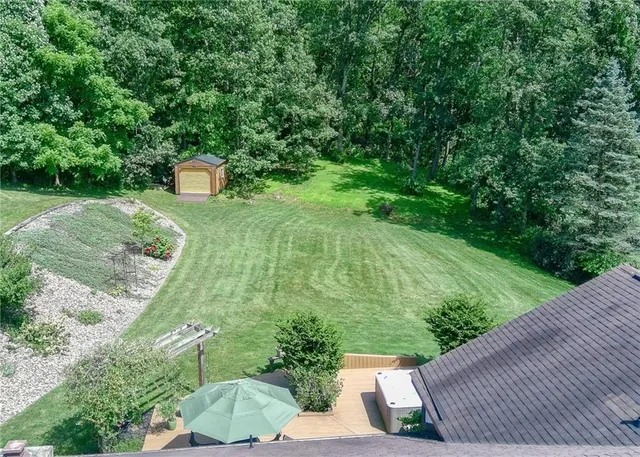 a view of a back yard from a balcony