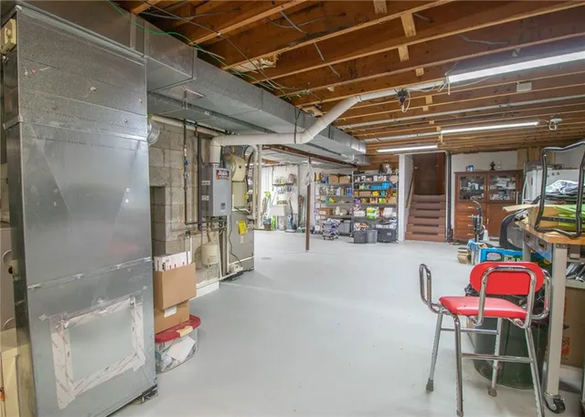a view of a hallway with dining area and chandelier