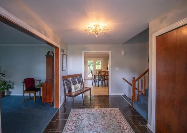 a living room with furniture and a rug