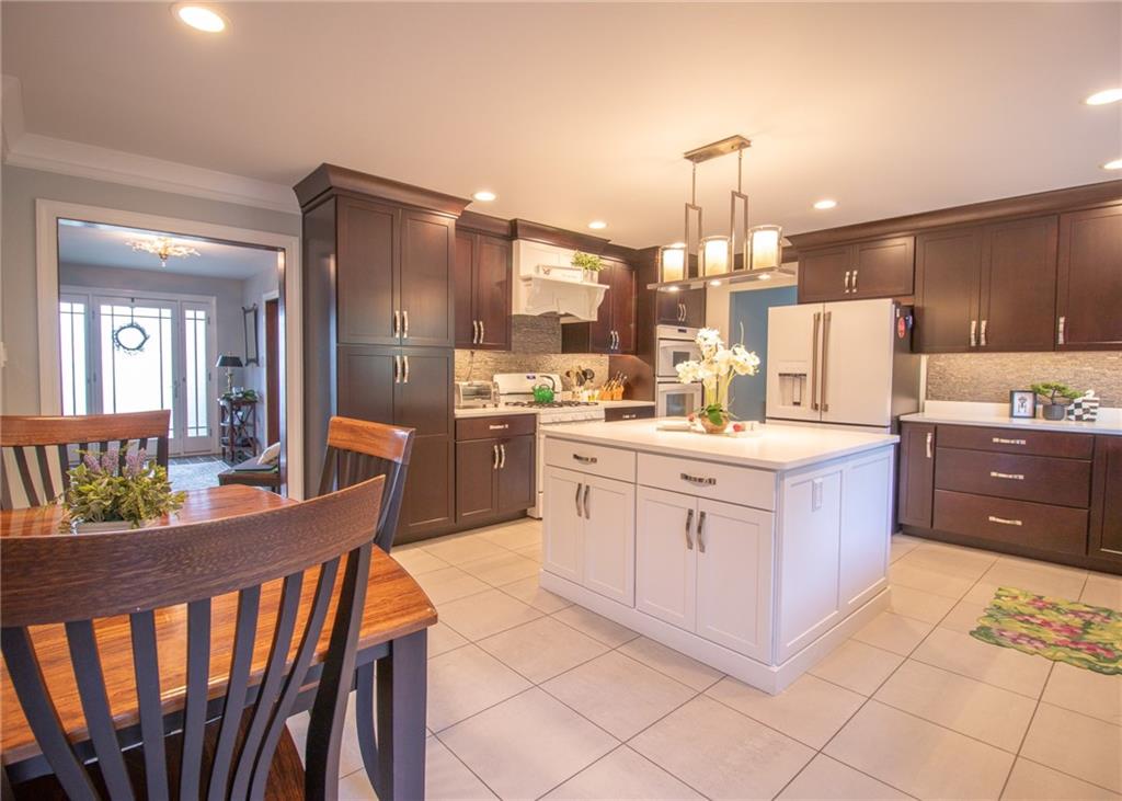 620 Timberline Lane New Stanton, PA 15672 - Photo 10 of 37 a large kitchen with kitchen island granite countertop lots of white cabinets