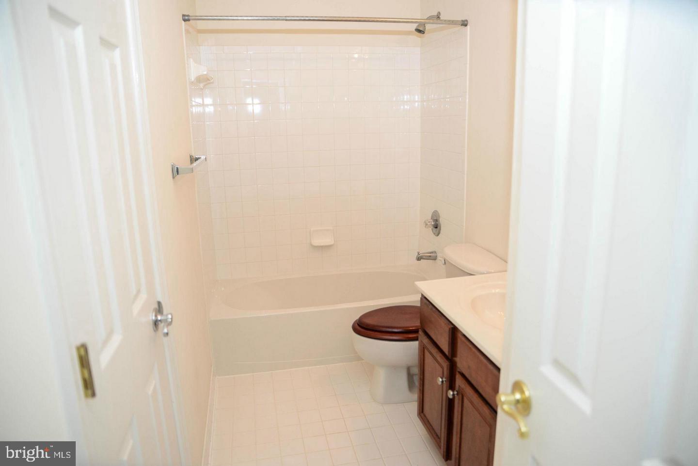 41898 Cinnabar Aldie, VA 20105 - Photo 19 of 33 a bathroom with a shower a toilet and a sink