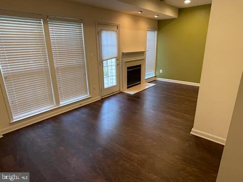 41898 Cinnabar Aldie, VA 20105 - Photo 23 of 33 an empty room with wooden floor fireplace and windows