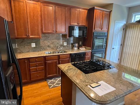 41898 Cinnabar Aldie, VA 20105 - Photo 9 of 33 a kitchen with stainless steel appliances granite countertop a stove a sink and a refrigerator