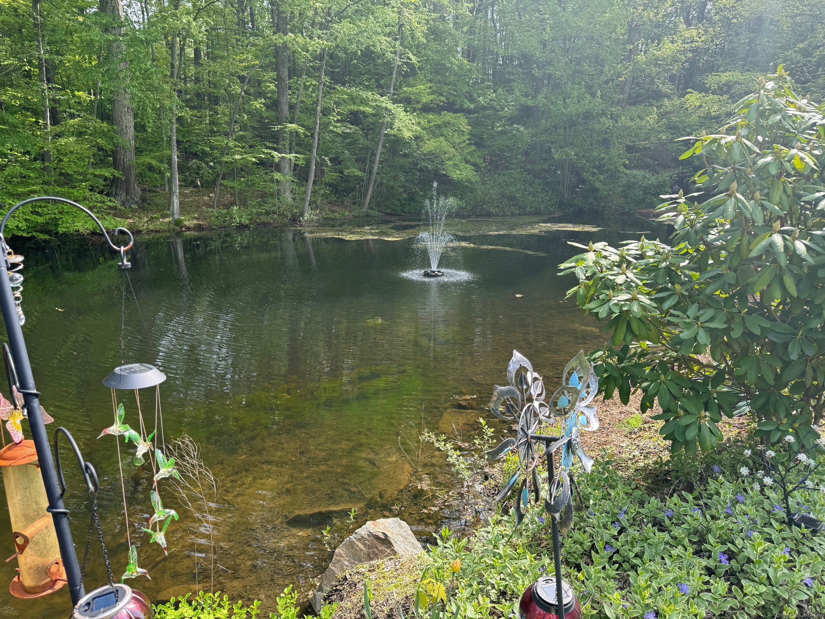 21 Highway 39, Unit A Sherman, CT 06784 - Photo 3 of 15 a backyard of a house with lots of green space and lake view