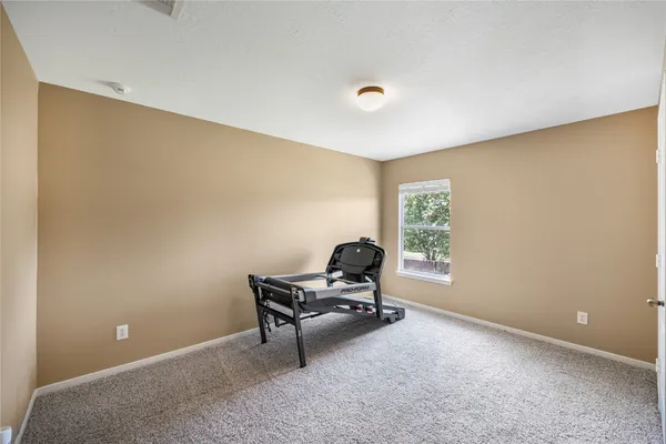 a room with furniture and a window