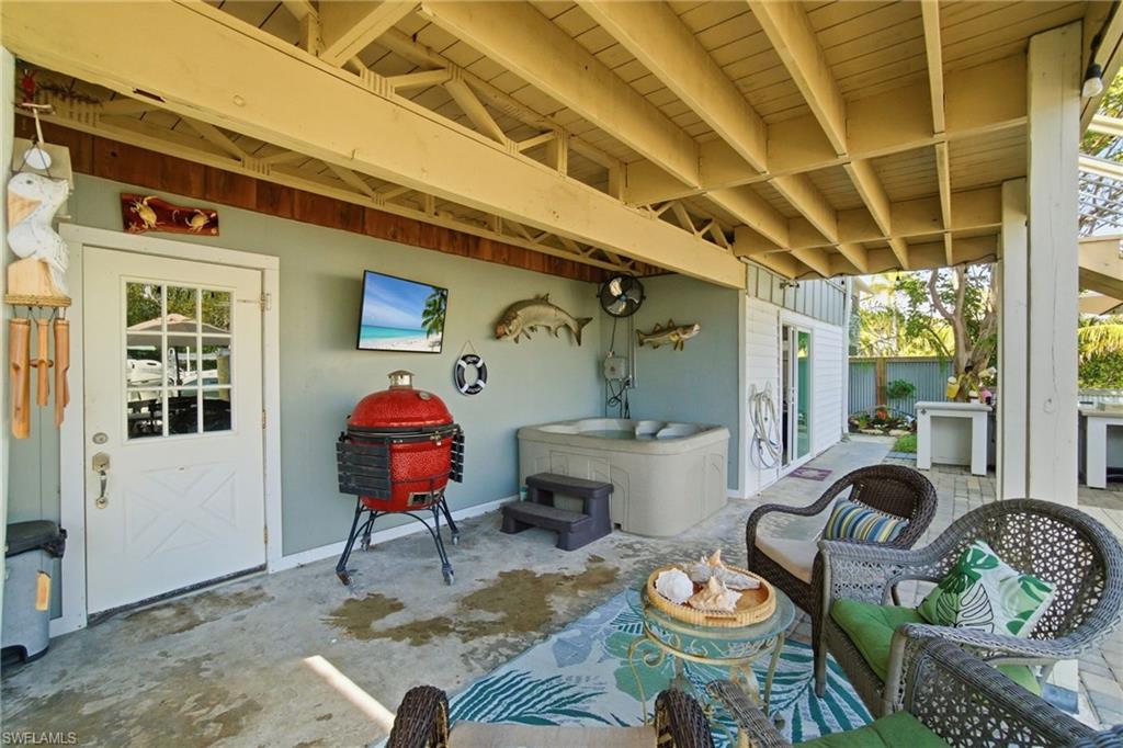 1286 Venetian Way Naples, FL 34110 - Photo 30 of 46 a living room with furniture and a table