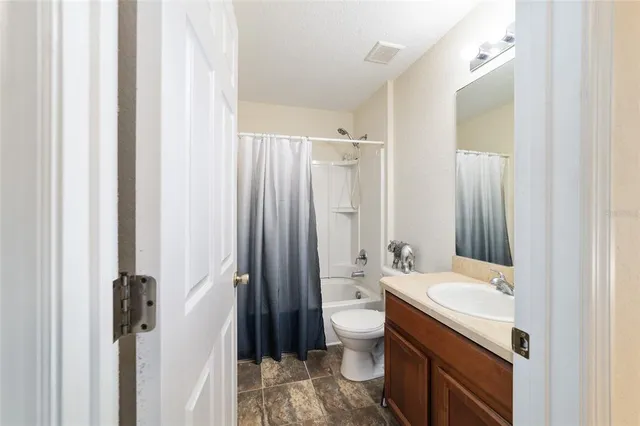 a view of a house with backyard sitting area and garden
