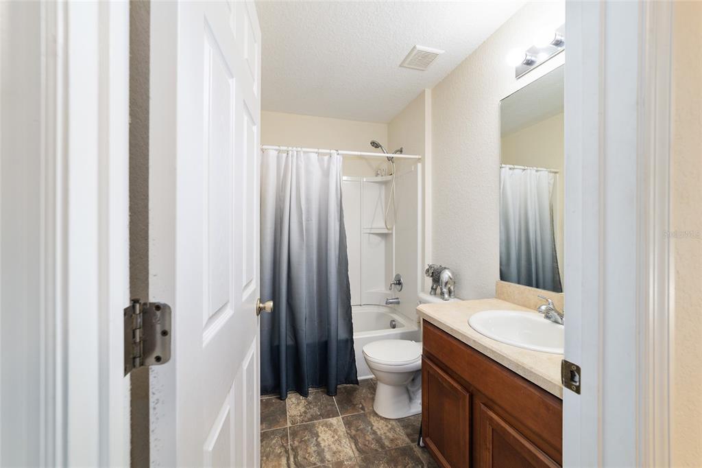 12312 Northeast 48th Loop Oxford, FL 34484 - Photo 45 of 54 a bathroom with a sink toilet and shower