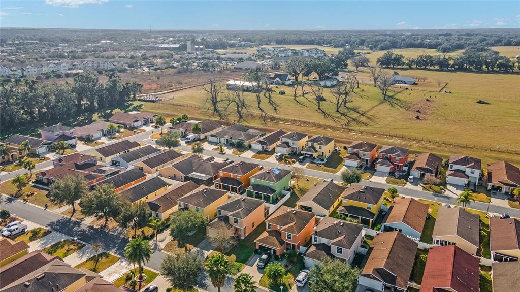12312 Northeast 48th Loop Oxford, FL 34484 - Photo 52 of 54 an aerial view of residential houses with outdoor space