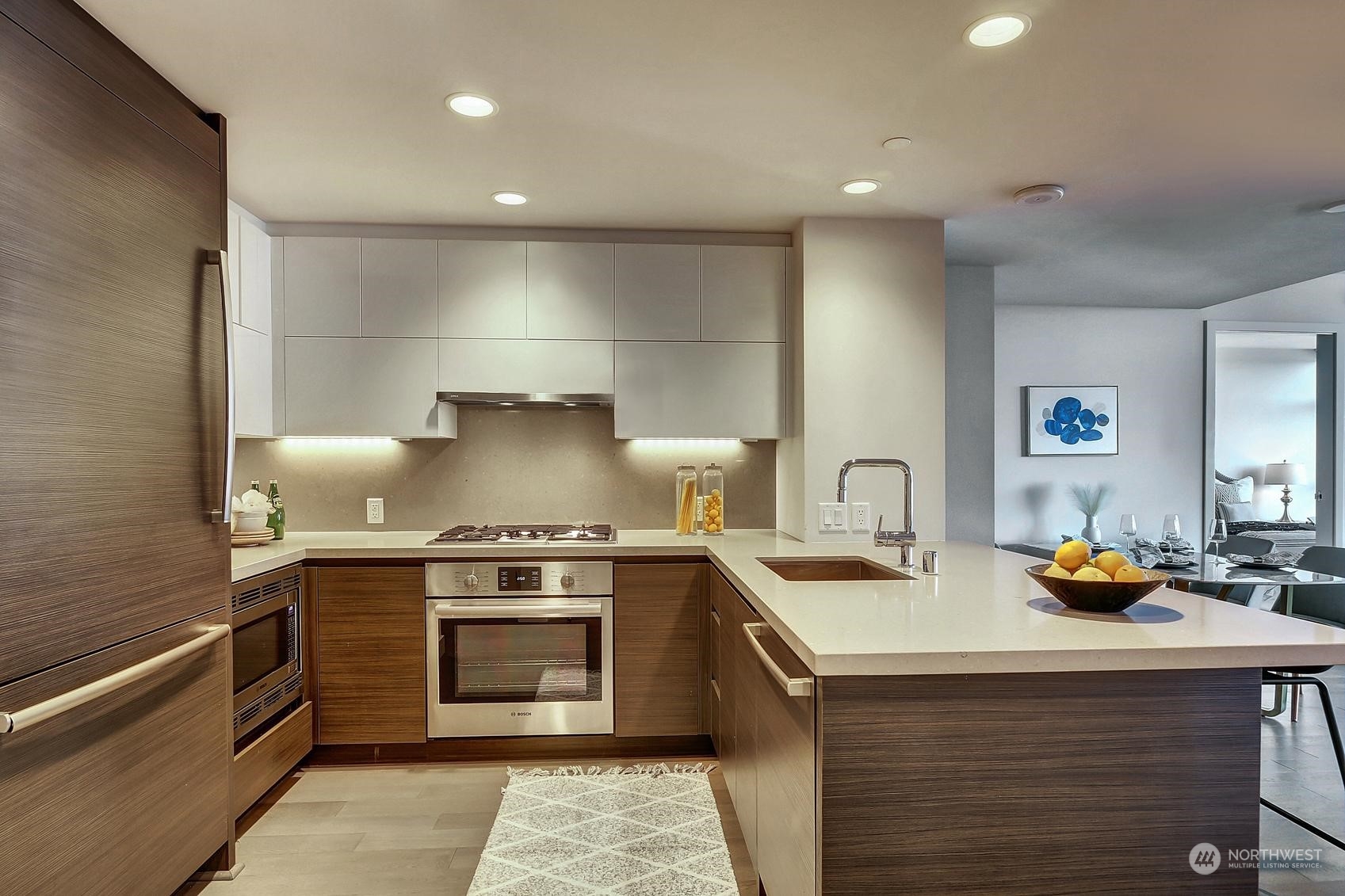 583 Battery Street, Unit 2708N Seattle, WA 98121 - Photo 11 of 30 a kitchen with a stove and a sink