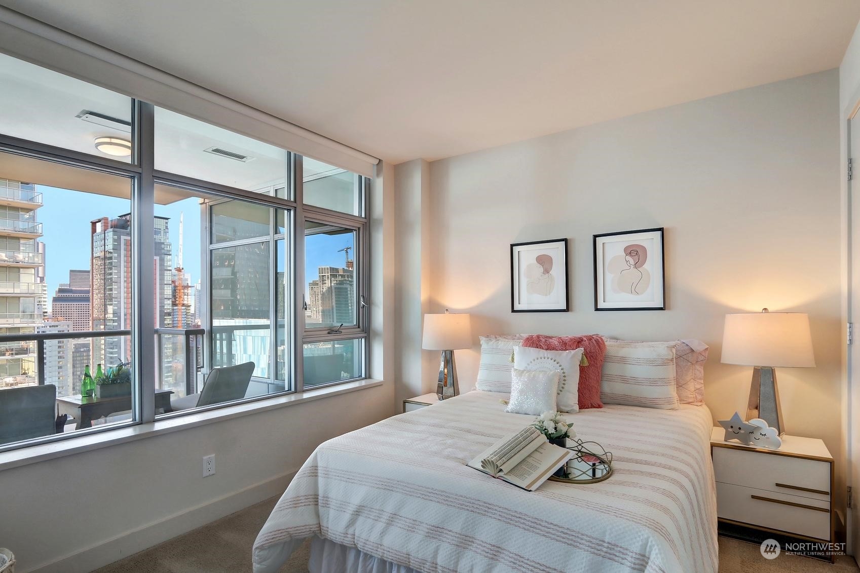 583 Battery Street, Unit 2708N Seattle, WA 98121 - Photo 18 of 30 a bedroom with a large bed and a window