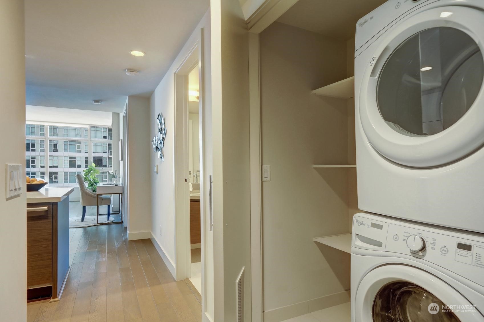 583 Battery Street, Unit 2708N Seattle, WA 98121 - Photo 20 of 30 a view of a hallway with washer and dryer