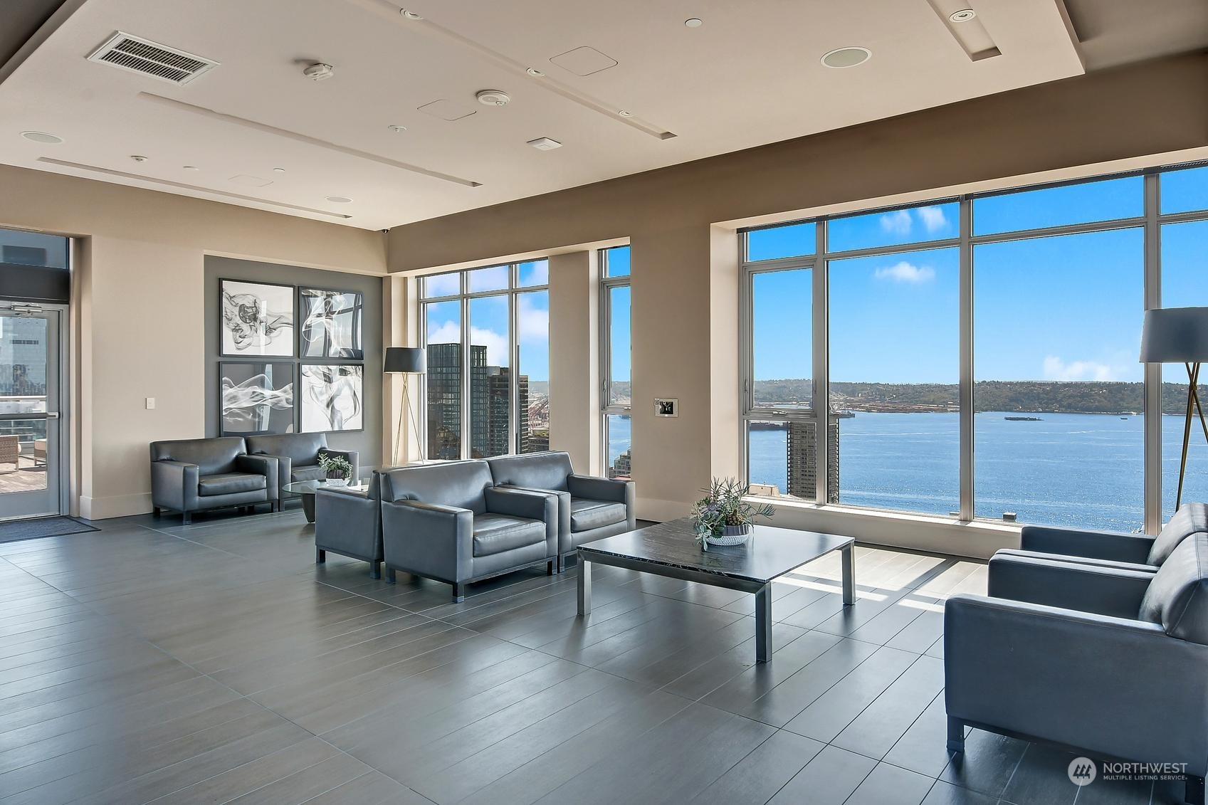 583 Battery Street, Unit 2708N Seattle, WA 98121 - Photo 25 of 30 a living room with furniture and floor to ceiling window