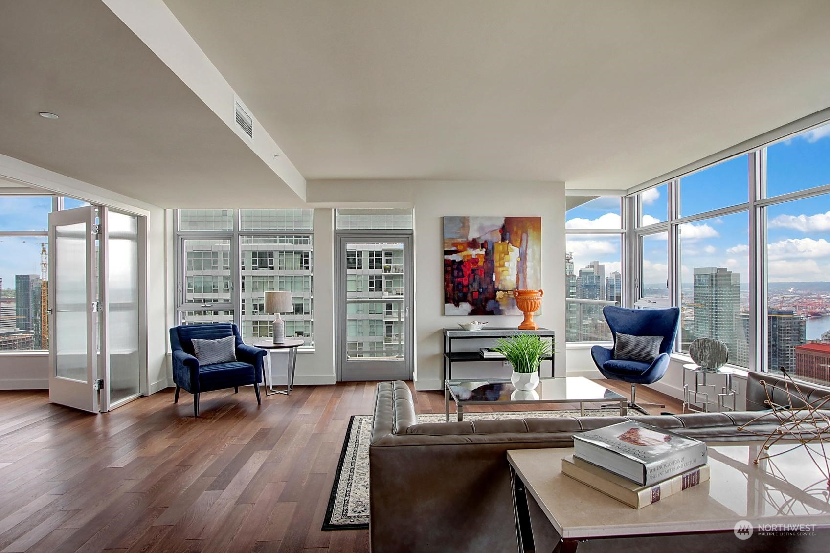 583 Battery Street, Unit 2708N Seattle, WA 98121 - Photo 26 of 30 a work room with furniture and large windows