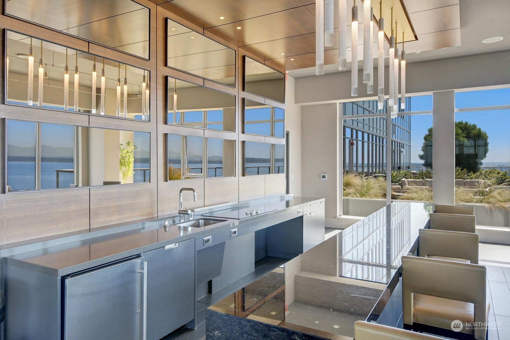 583 Battery Street, Unit 2708N Seattle, WA 98121 - Photo 29 of 30 a kitchen with a sink and living room