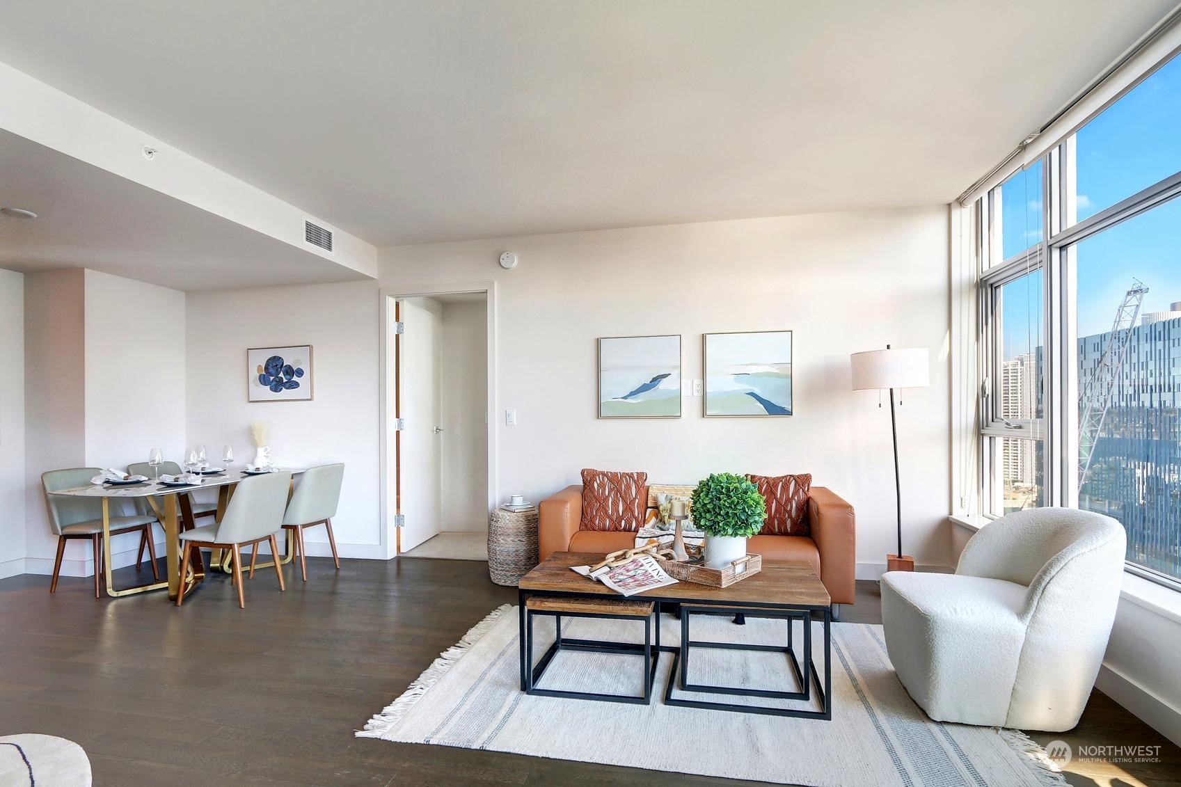 583 Battery Street, Unit 2708N Seattle, WA 98121 - Photo 5 of 30 a living room with furniture a rug a table and a large window