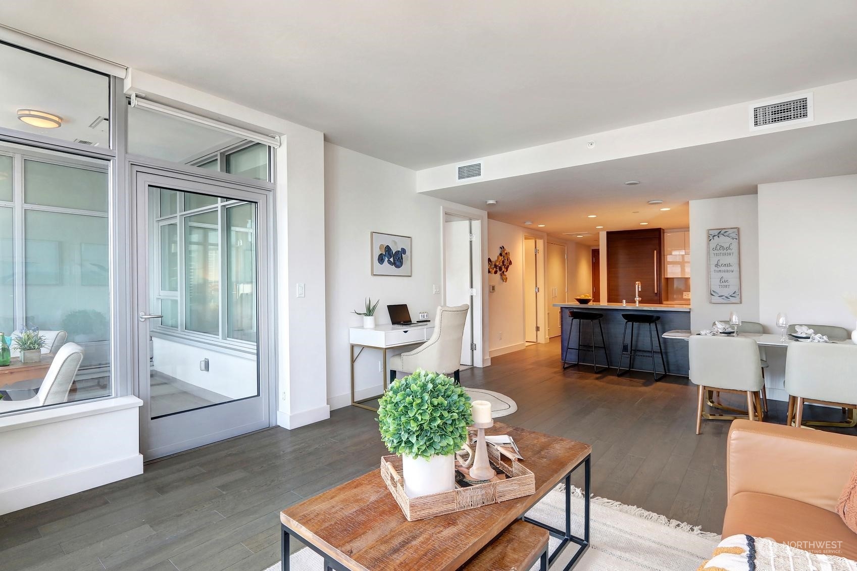 583 Battery Street, Unit 2708N Seattle, WA 98121 - Photo 6 of 30 a living room with furniture and a wooden floor