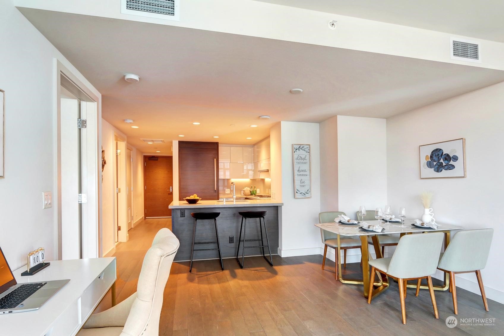 583 Battery Street, Unit 2708N Seattle, WA 98121 - Photo 7 of 30 a view of a dining room with furniture window and wooden floor