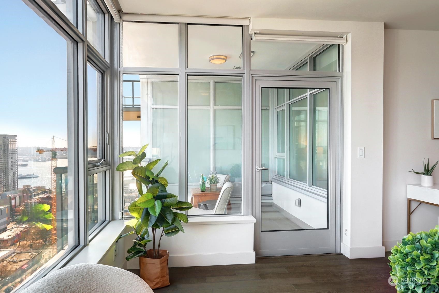 583 Battery Street, Unit 2708N Seattle, WA 98121 - Photo 9 of 30 a living room with furniture and a potted plant